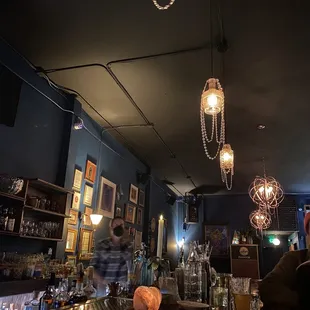 a bar with people sitting at the bar