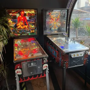two pinball machines in a room