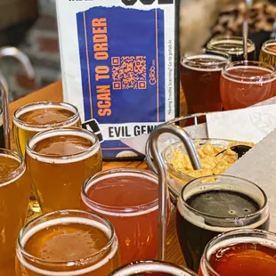 a table full of beer glasses