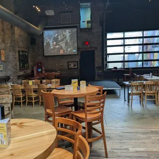 people sitting at tables in a pub