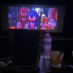 Mango house margarita , water and popcorn