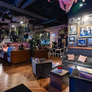 a living room filled with furniture and pictures