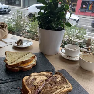 Ham and cheese sandwich to the left and Reuben to the right both really good sandwiches