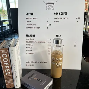 a menu and a glass of iced coffee