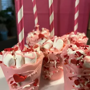 a close up of a cupcake with marshmallows and sprinkles