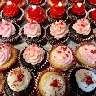 a tray of valentine cupcakes