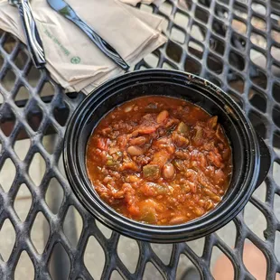 a bowl of chili on a table