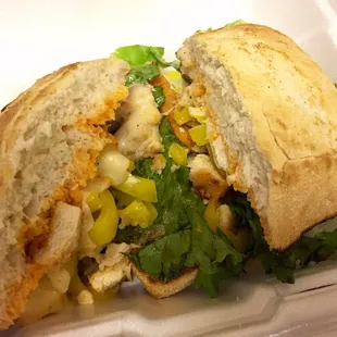 a sandwich in a styrofoam container