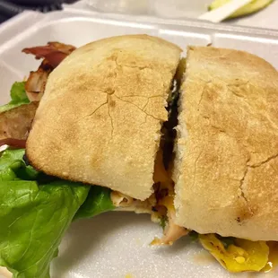 a sandwich in a styrofoam container