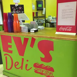 a neon green counter with a neon red sign