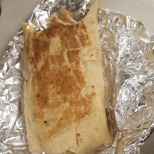 Fully loaded breakfast burrito. I couldnt wait to take a bite. Lol