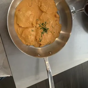 Crab ravioli in lobster sauce