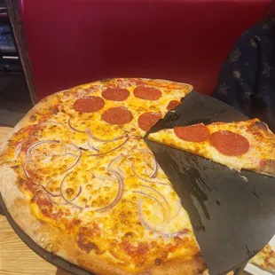 Delicious extra cheese, half pepperoni, half onion.