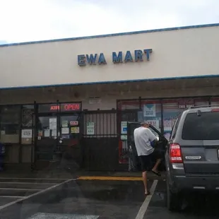 a man standing in front of a store