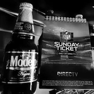 a bottle of beer and a ticket