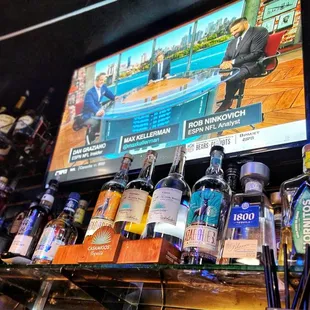 a television and liquor bottles