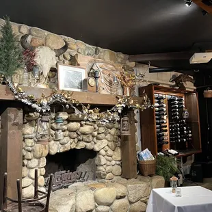 a stone fireplace in a restaurant