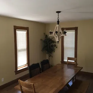 a dining room with a table and benches