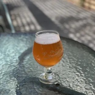 a glass of beer on a table