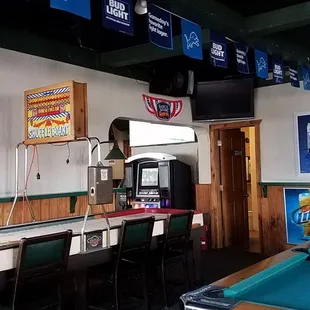 a billiards bar with a pool table