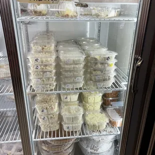 ows a refrigerator full of cupcakes