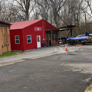 ows a fire hydrant in front of a red building