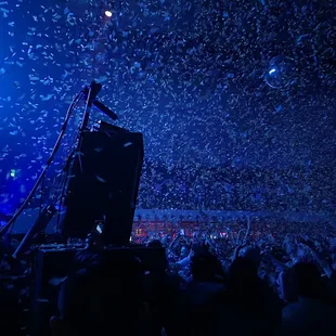 confetti falling from the sky at a concert