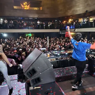 a group of people on stage at a concert