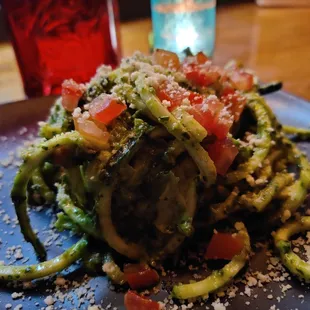 a plate of pasta with vegetables