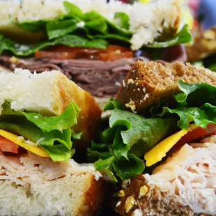 a plate of sandwiches with meat and lettuce