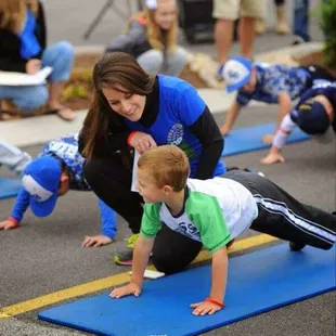 Miss Kelley Bettag helping OpFitness train one of BG's Little League teams.