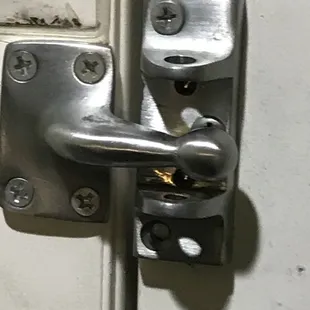 Broken door security latch at Executive Inn, Mojave.