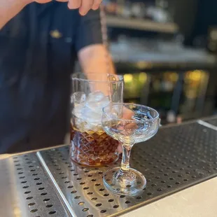 a bartender pouring a drink