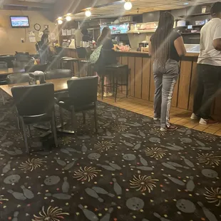 Lady to the far left (behind the counter)...Awful disposition!!