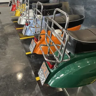 a row of scooters in a showroom