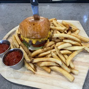 a cheeseburger with fries and ketchup