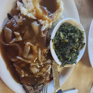 Liver and onions, mashed potatoes with gravy and turnip greens.