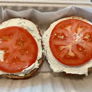 two halves of a tomato and cheese sandwich