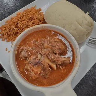 Oxtail, jollof rice, yam fufu