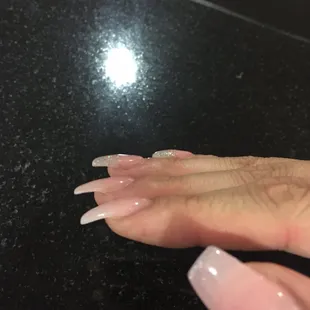 The nail tips they use curve down