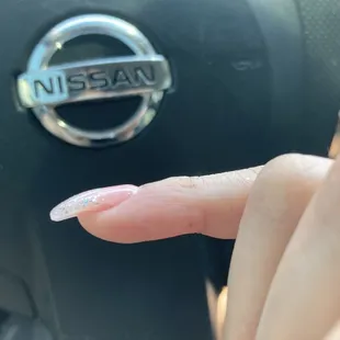 Acrylic not fully filled in, understandable but the nail technician did not take account of that during the process of applying acrylic.