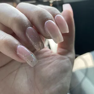 Acrylic was not filled on the sides properly; real nail should have been filed back on the side if that was not possible.
