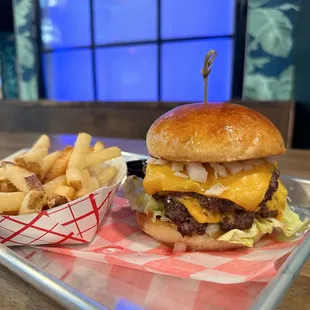 Classic Smashy: Two Smashed brisket patties, shredded lettuce, tomato, pickles, mustard, and diced onions.