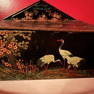 two cranes in a garden