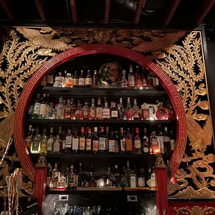 a shelf of liquor bottles