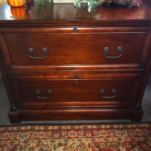this traditional cherry wood file cabinet with finished backing! This piece is now $425