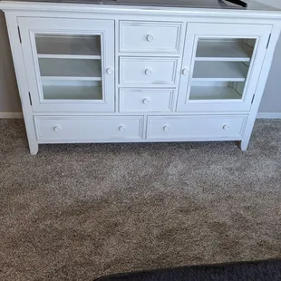 This is a beautiful media center Plenty of drawers and shelves with glass doors.