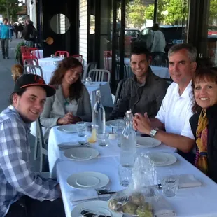 Family from Omaha visiting an adult child living here now, on the Mission Food Tour North. Having Pizza and Prosciutto and Melon