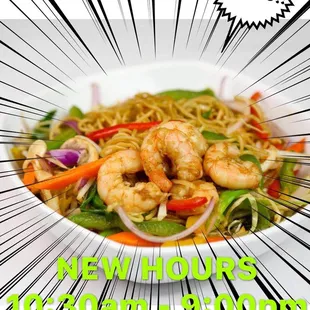 a plate of noodles with shrimp and vegetables