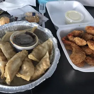 Delivery - took an hour (longer than usual) Fried shrimp comes w yummy coconut sauce And my usual half fried half steam dumplings
